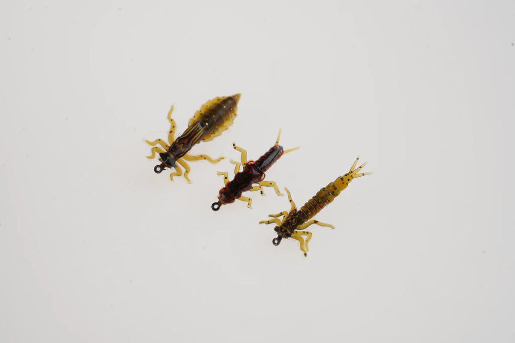 Finished stonefly patterns tied with realistic nymph bodies