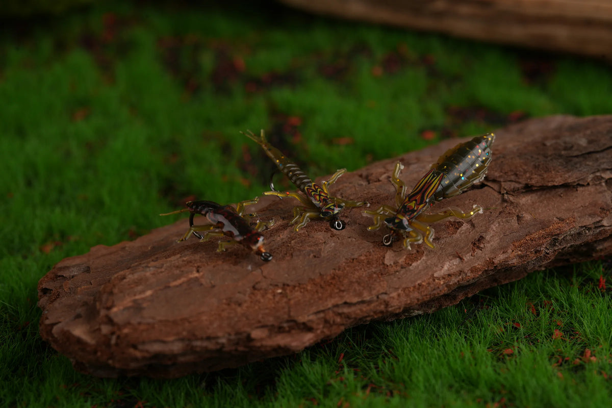 Three realistic stonefly nymph tying examples on wood and moss