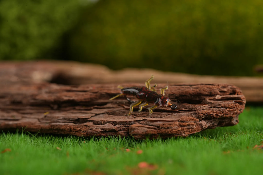 Realistic stonefly nymph fly side profile on bark