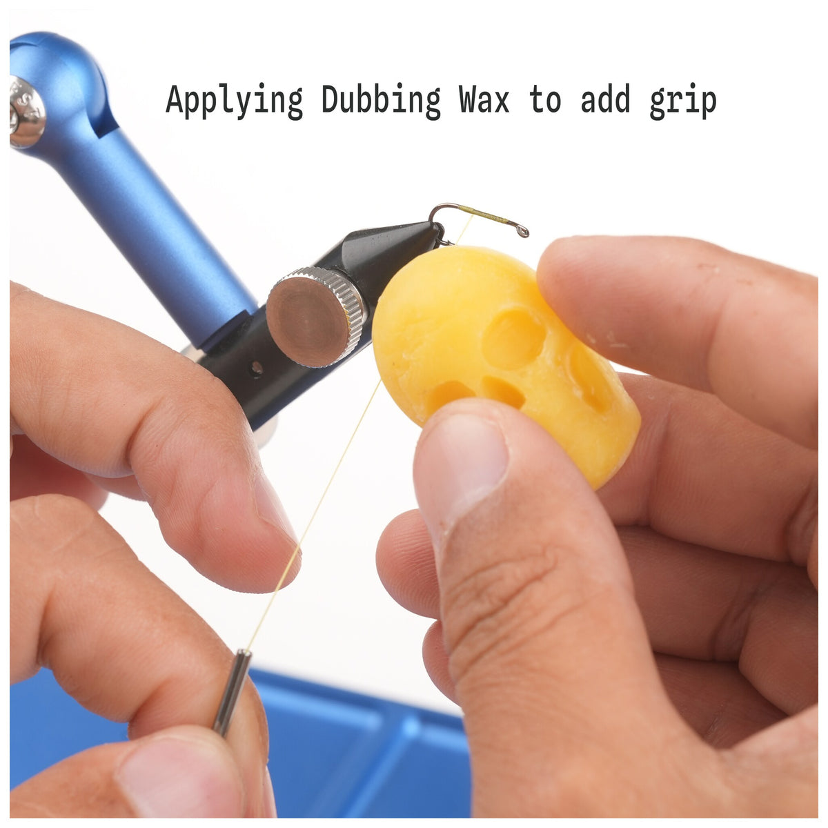 Applying solid dubbing wax to fly tying thread for added grip